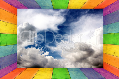 multicilored frame on the blue sky background