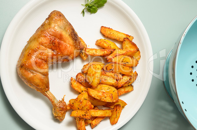 Roasted chicken with potato wedges