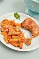 Roasted chicken with golden potato wedges