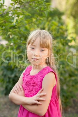 Girl in a crimson dress on nature