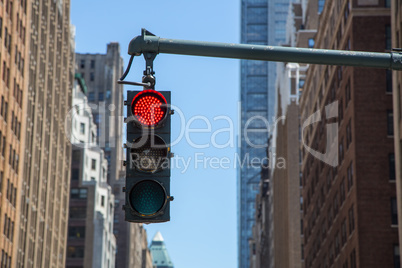 Traffic light on the background of skyscrapers in New York