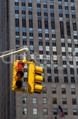 yellow traffic light on the background of skyscrapers in NY
