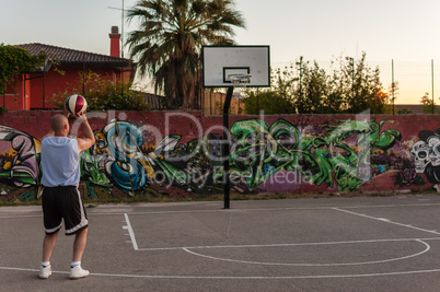 Basketball player in city playground