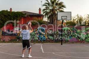 Basketball player in city playground