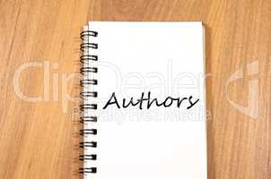 Authors write on notebook