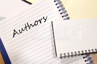 Authors write on notebook