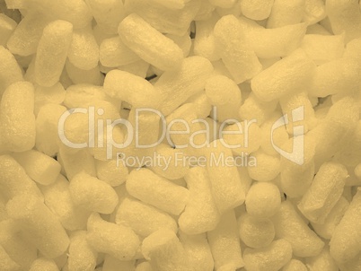 White polystyrene beads background sepia