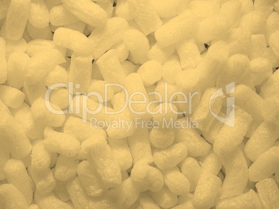 White polystyrene beads background sepia