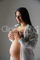 Image of beautiful smiling woman expecting child