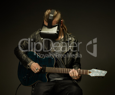 Guitarist plays in a virtual reality glasses.