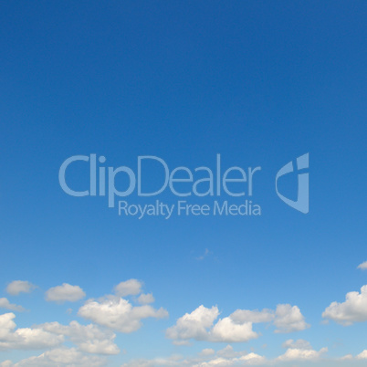 light cumulus clouds in the blue sky