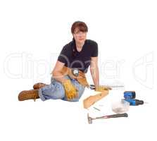 Woman sitting with her tools.