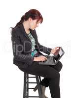 Woman working on her laptop.