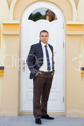 Confident bride in an expensive suit