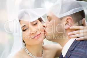Groom in white shirt kissing bride hand. Very gentle photo