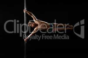 Pole dance. Image of dancer with strained face