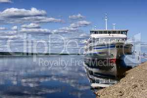 Passenger boat moored to a river Lena bank