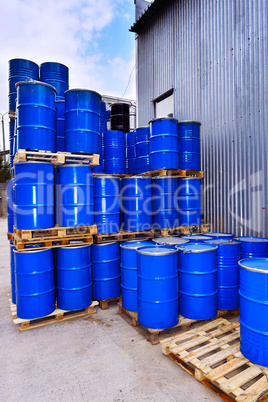Blue metal fuel tanks of oil stored at the production site
