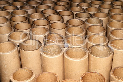 Manufacturing background in the form of cardboard tubes