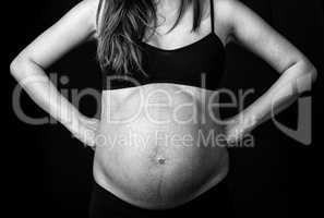 Belly of a pregnant woman, superhero concept.