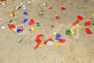 Children's sandbox with toys scattered
