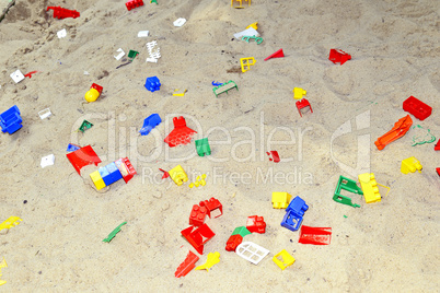 Children's sandbox with toys scattered