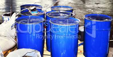 Blue metal fuel tanks of oil stored at the production site