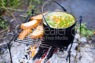 The cooking of soup on the fire