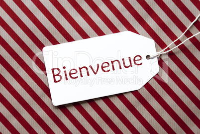 Label On Red Wrapping Paper, Bienvenue Means Welcome