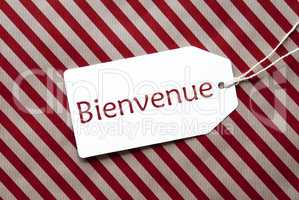 Label On Red Wrapping Paper, Bienvenue Means Welcome