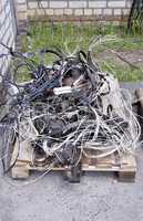 Metal waste, lie on a wooden pallet warehouse on the open industrial waste