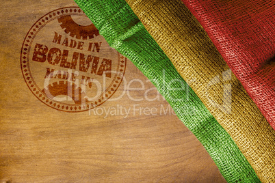 Imprint of Made in Bolivia on a wooden surface