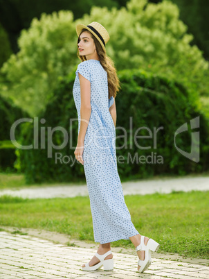 Beautiful young woman in a summer dress.