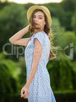 Beautiful young woman in a summer dress.