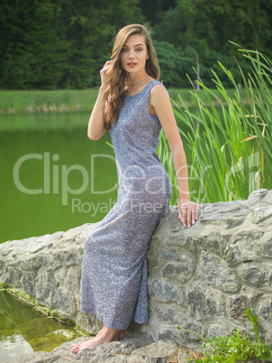 Beautiful young woman in a summer dress.