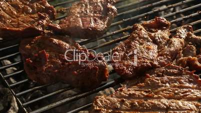 Closeup of meat on BBQ grill