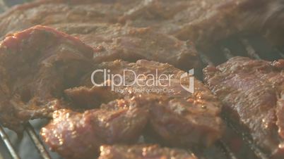 Closeup of pork on a BBQ grill