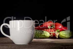Cup of coffee and vegetables