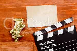 Theatrical masks and movie clapper