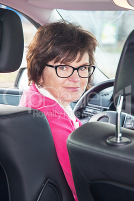 Middle-aged woman in the car