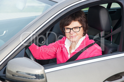 Middle-aged woman in the car