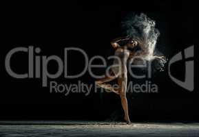 Amazing photo of graceful woman dancing with dust