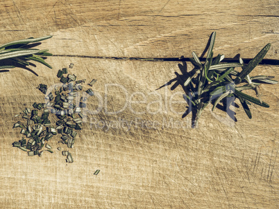 Rosemary plant on cutting board vintage desaturated