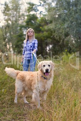 Girl walking with a dog