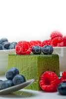 green tea matcha mousse cake with berries