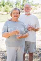 Happy Healthy Senior Couple with Water Bottles