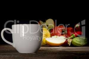 Cup of coffee, vegetables and fruits