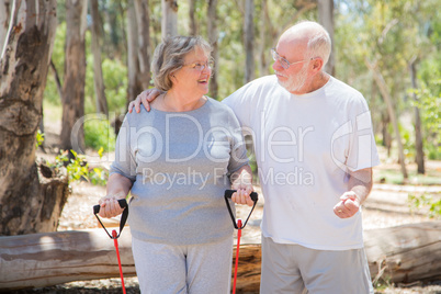 Happy Senior Couple Exercising Outside Together