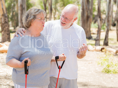 Happy Senior Couple Exercising Outside Together