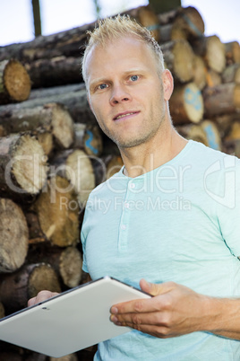 Man in the woods with Tablet PC